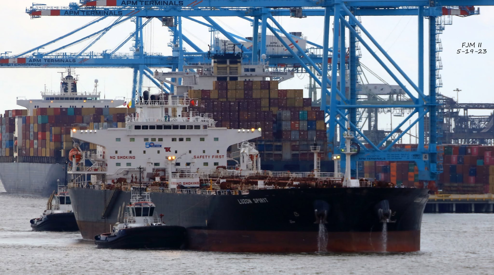 Luzon Spirit assisted by tugs in port