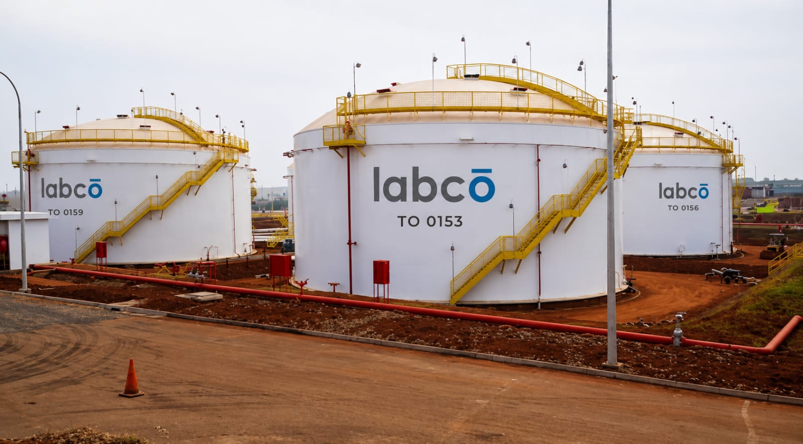 Labco-branded storage tanks at a terminal with pipe runs
